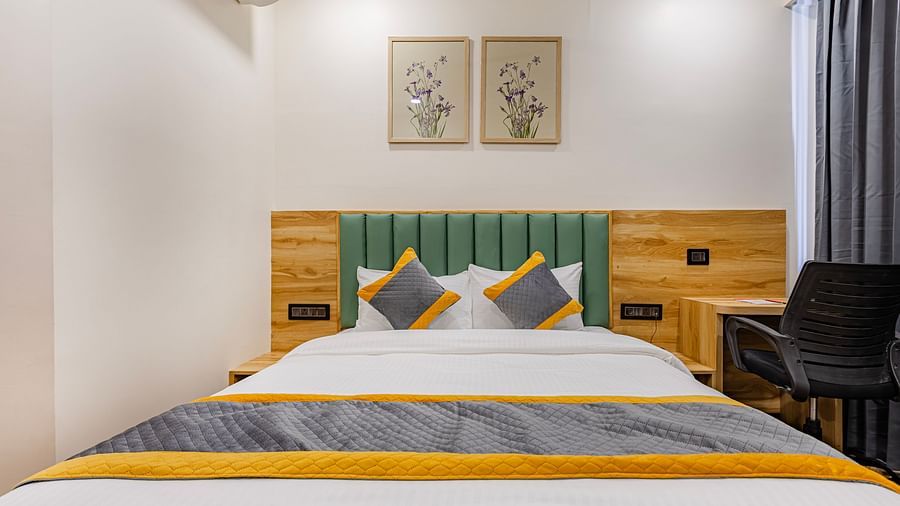 Lemonridge Hotels, KPHB | Lemon Ridge Hotels, KPHB: Hotel room with a double bed, headboard, and artwork on the wall. Clean and simple design.